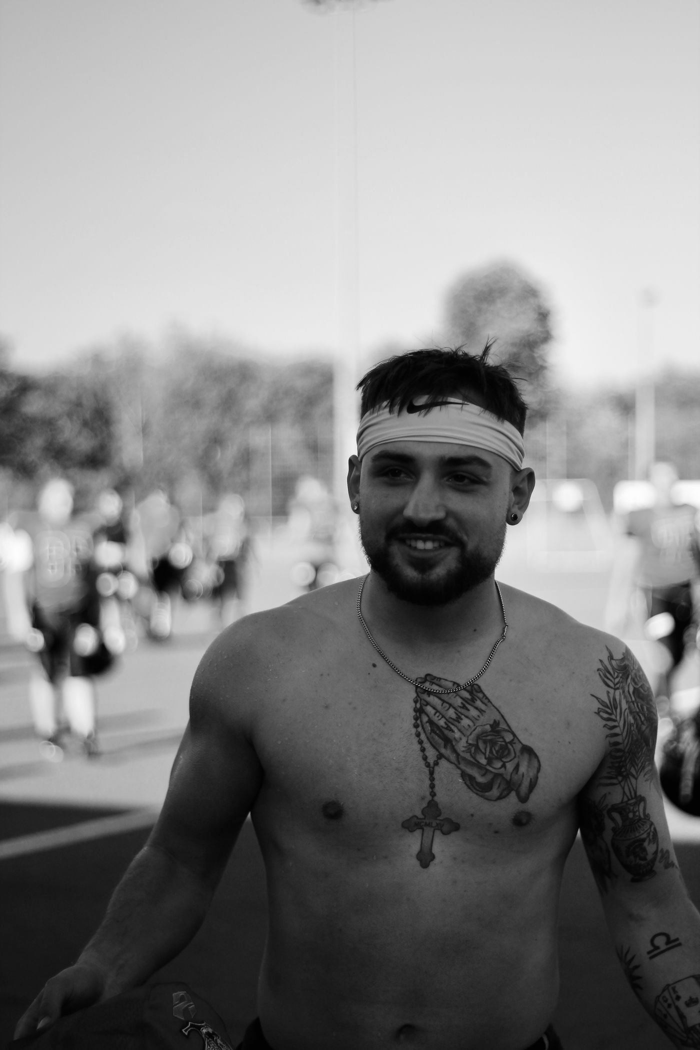 Nate Bock in black and white, smiling, on a football field.